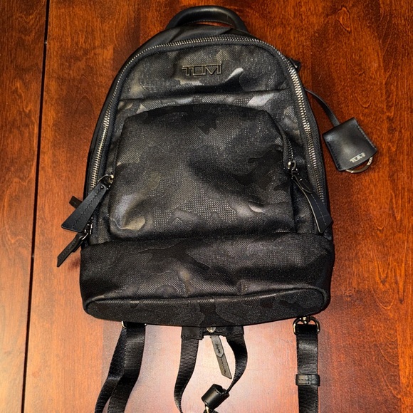 Tumi Handbags - NWOT RARE TUMI Monett Black Camo mini sling backpack